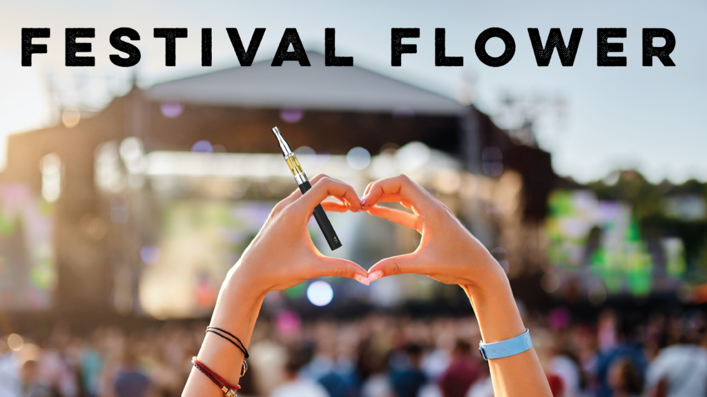 Crowded Music Festival with two concertgoer's hands forming a heart with their two hands holding a vape cartridge.